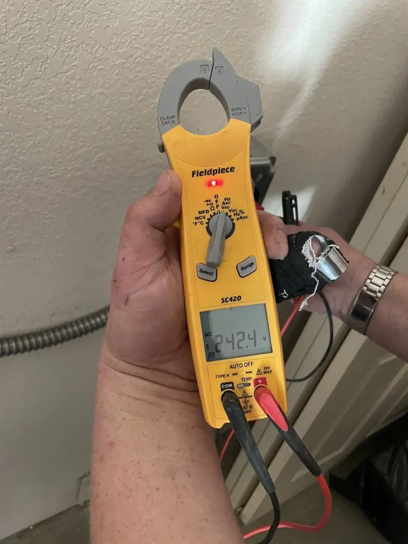 Voltage testing with clamp meter during Recessed Lighting Installation in Hoosick Falls